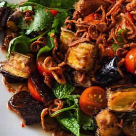 Crispy Eggplant Salad with Tomatoes, Herbs, and Fried Shallots